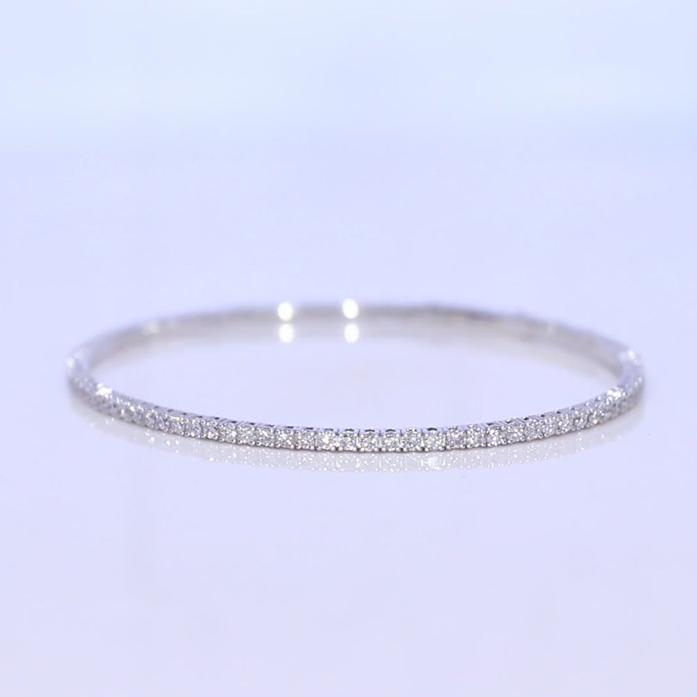 
                  
                    Charger et lire la vidéo dans la visionneuse de la galerie, 1.8mm Luxurious 14K Flex Tennis Bangle
                  
                